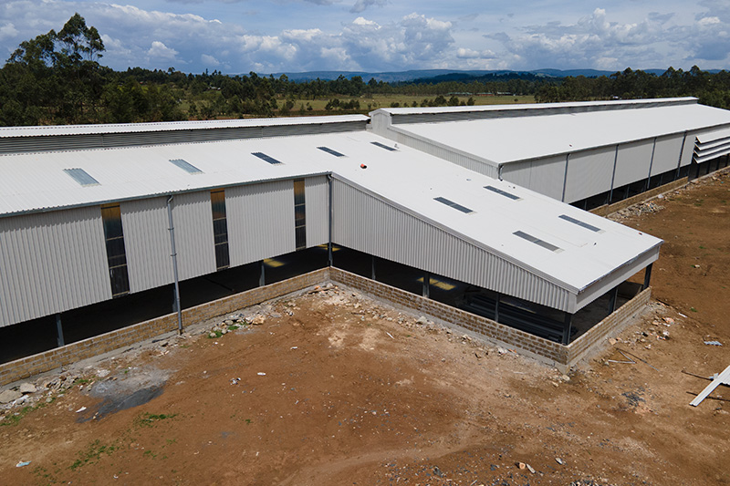 A large, modern poultry farm building.