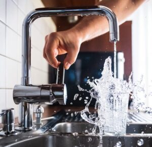 person opening faucet